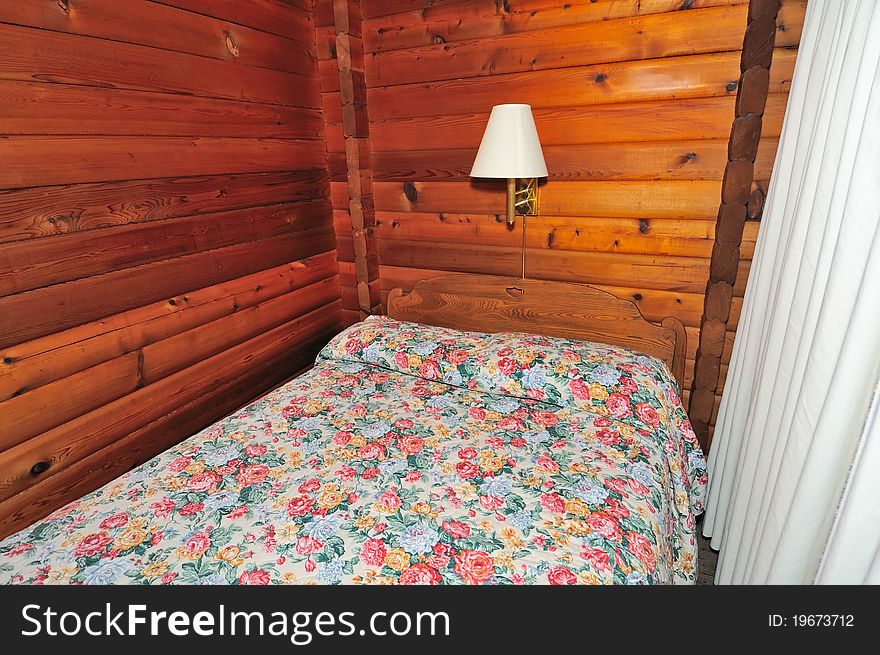 Unique cottage style bedroom with wooden architecture. Unique cottage style bedroom with wooden architecture.