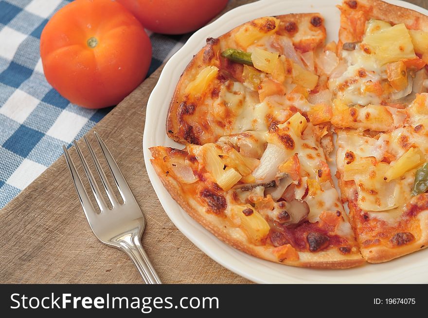 Healthy vegetarian pizza topped with cheese and spices.