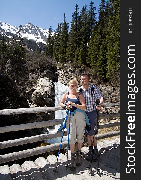 Retired couple hiking in the alps