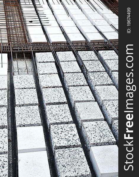 Technical detail of building operations: floor. Materials: polystyrene, steel bars, concrete. Technical detail of building operations: floor. Materials: polystyrene, steel bars, concrete