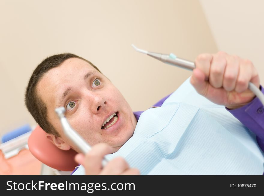 Man waiting for a dentist in stomatology place. Man waiting for a dentist in stomatology place