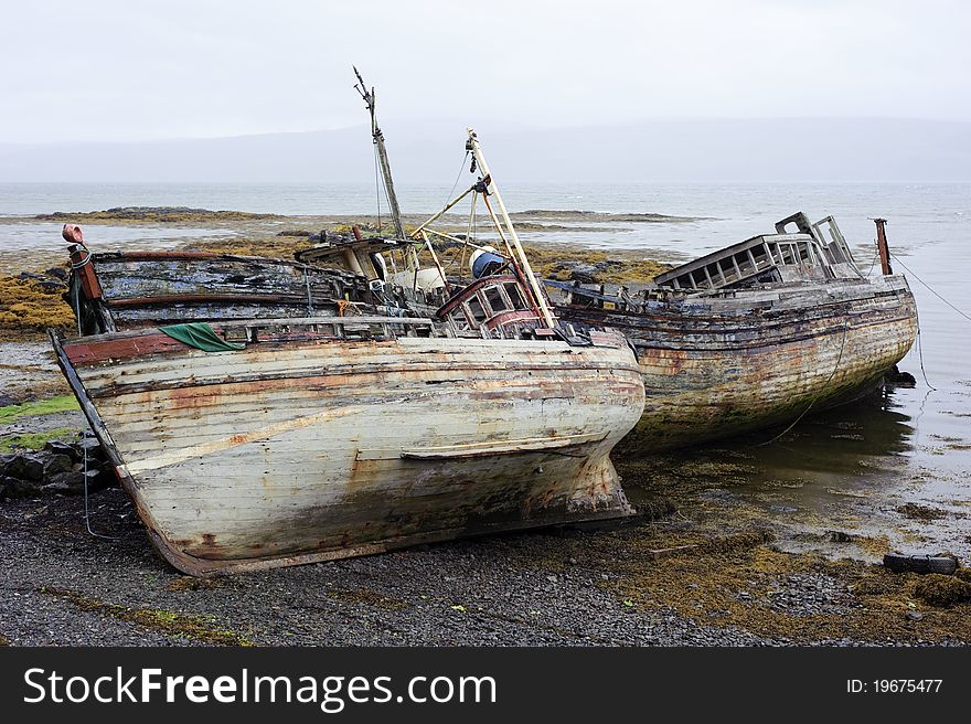 Photograph of rotting old boats taken near Salen on the Isle of Mull, Scotland on a typically overcast day. Photograph of rotting old boats taken near Salen on the Isle of Mull, Scotland on a typically overcast day.