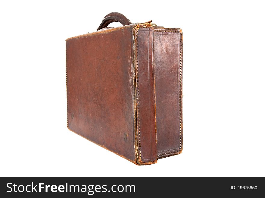 Old style brown leather suitcase on a white background viewed at an angle. Old style brown leather suitcase on a white background viewed at an angle