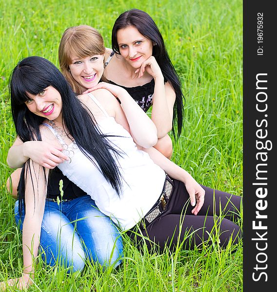 Three smiling girl friends outdoor. Three smiling girl friends outdoor