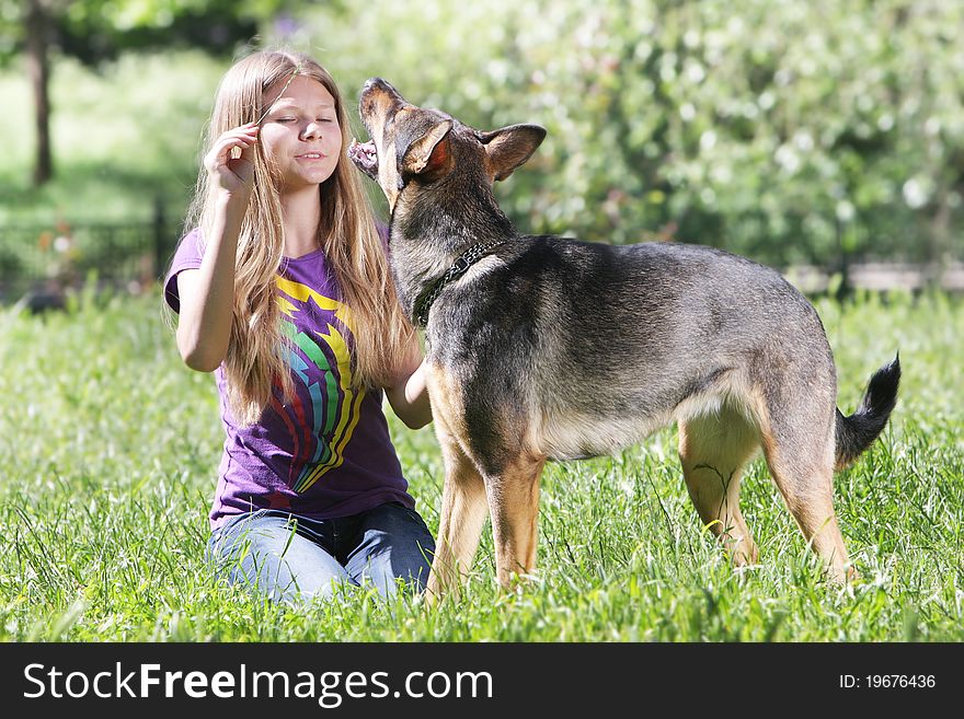 Teen girl with dog outdoors