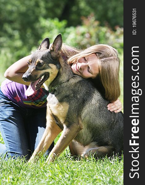 Young girl with dog outdoors