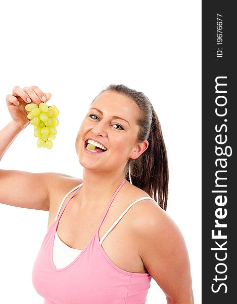 Young woman eating fresh grapes. Young woman eating fresh grapes