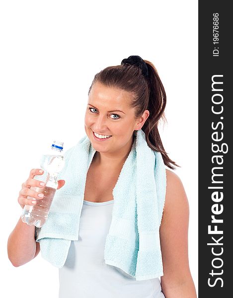 Young woman drinking water after exercise