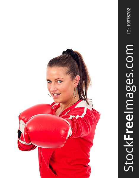 Young woman boxing by on withe