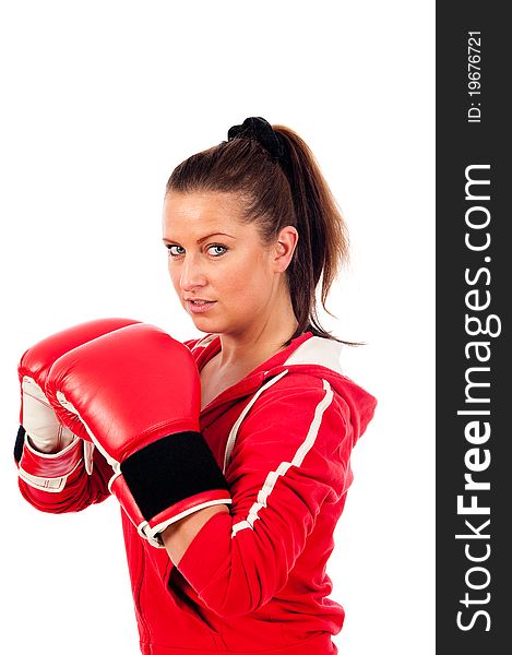 Young woman boxing by on withe