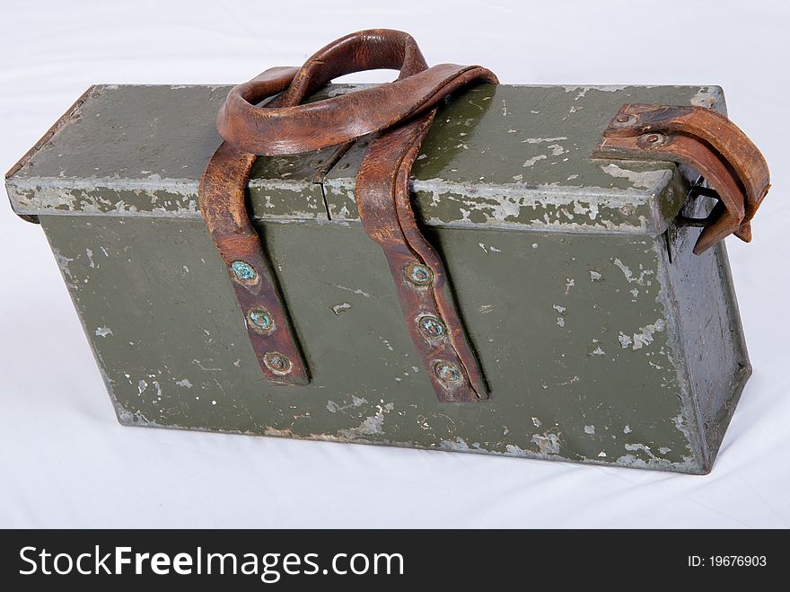Old green ammo box with leather handels