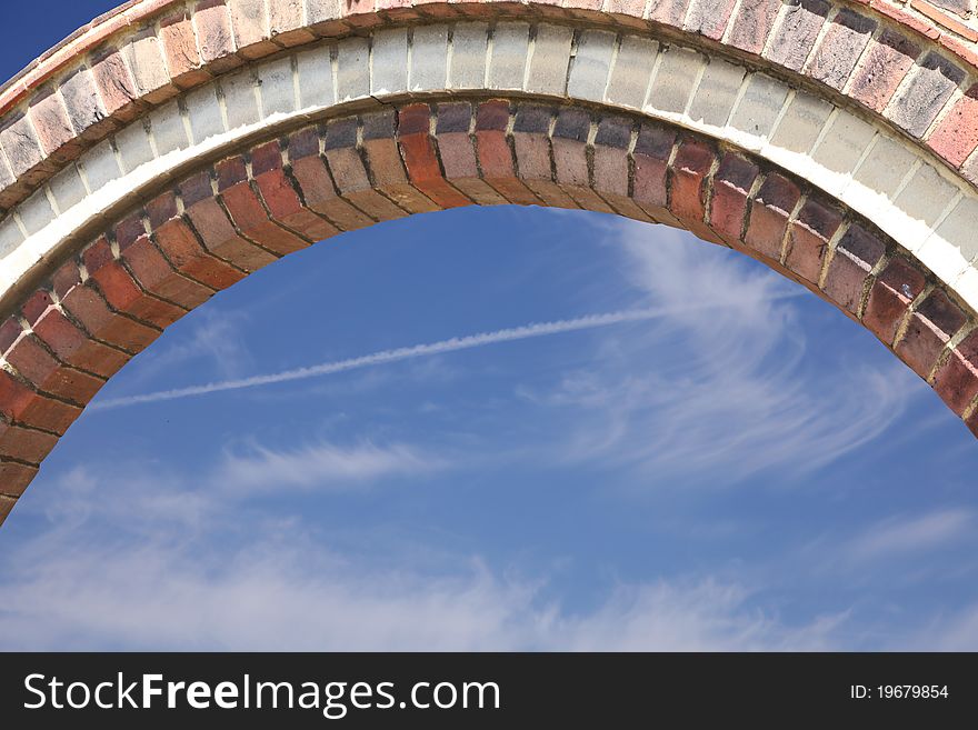 Close up of brickwork arch with sky