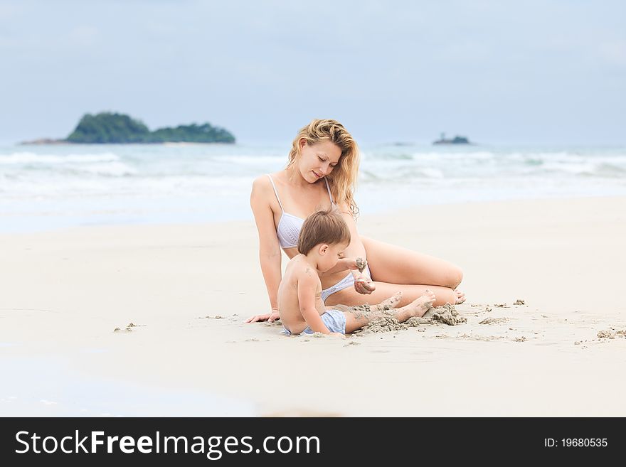 Baby with mother on a beach. Baby with mother on a beach