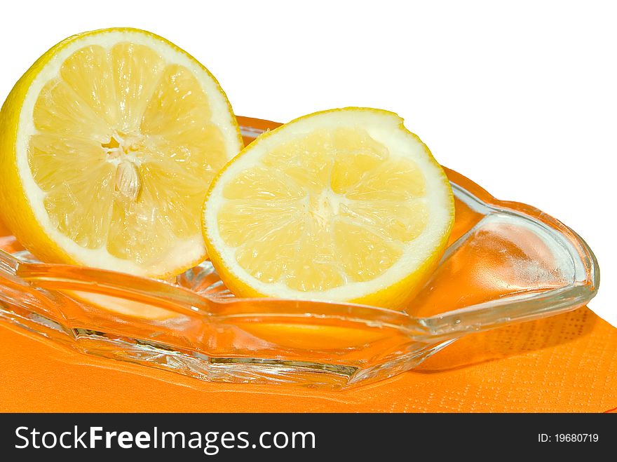 Two lemons on a plate, white background. Two lemons on a plate, white background