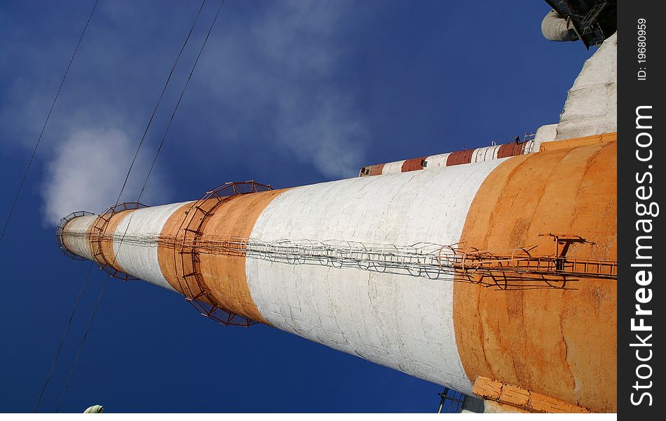 Two of the most high exhaust pipes at a cement plant. Western Russia. Two of the most high exhaust pipes at a cement plant. Western Russia