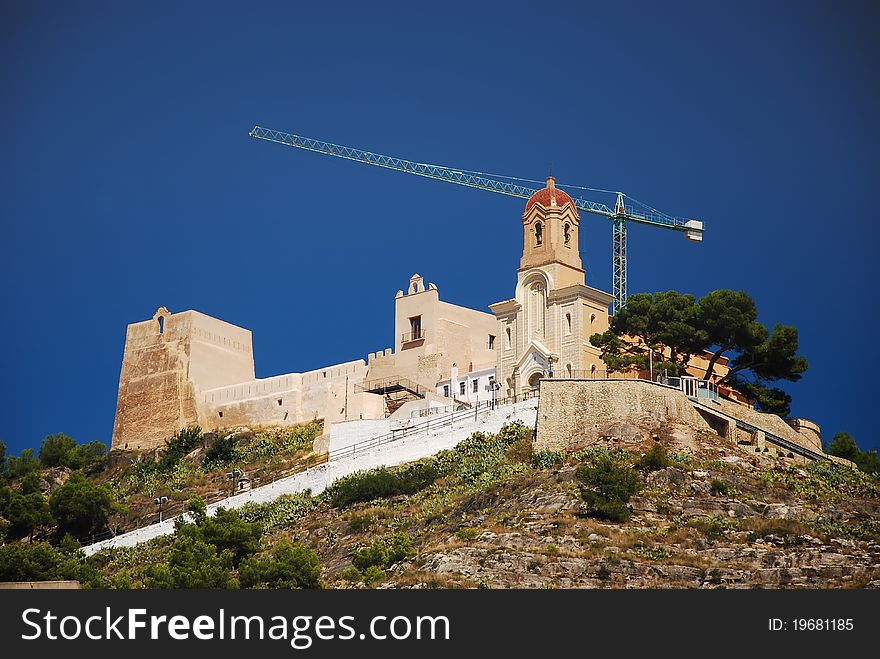 View of castle construction and religious architecture in Cullera, Valencia, Spain. View of castle construction and religious architecture in Cullera, Valencia, Spain