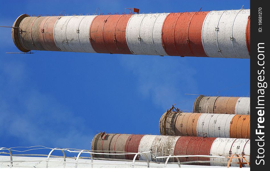 Four of the most high exhaust pipes at a cement plant. Western Russia. Four of the most high exhaust pipes at a cement plant. Western Russia