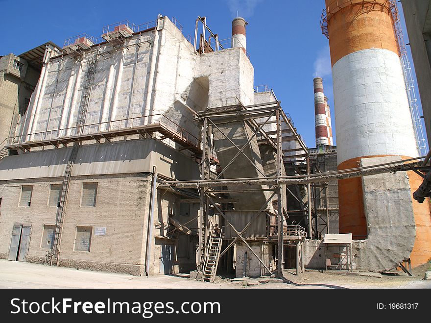 High brick chimneys at a cement plant. Western Russia. High brick chimneys at a cement plant. Western Russia