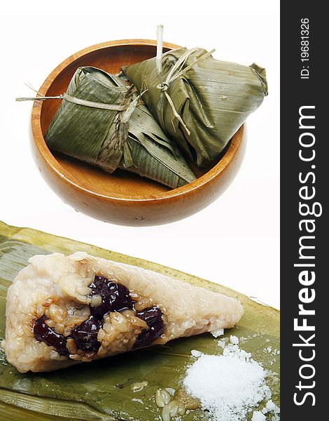 Chinese traditional food -- Rice dumpling. Chinese traditional Zongzi includes glutinous rice and red jujube. With white sugar together edible.