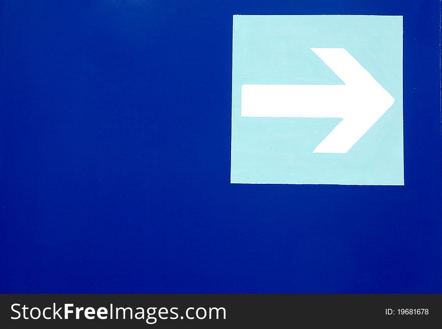 Right arrow sign on blue