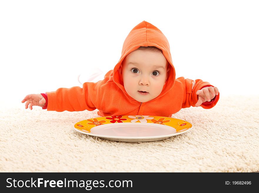 Funny baby girl with a colorful plate. Funny baby girl with a colorful plate