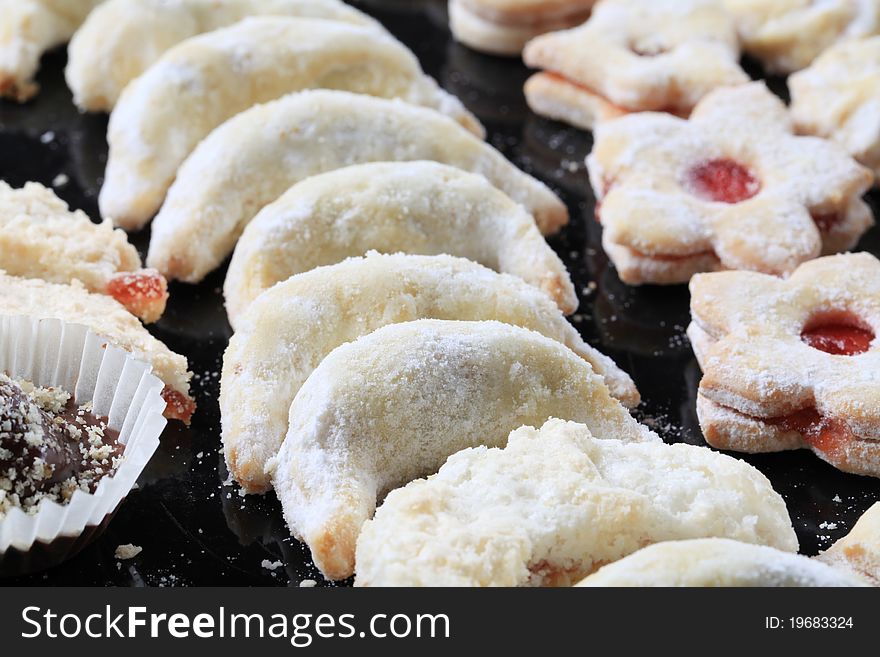Christmas cookies sprinkled with icing sugar - detail