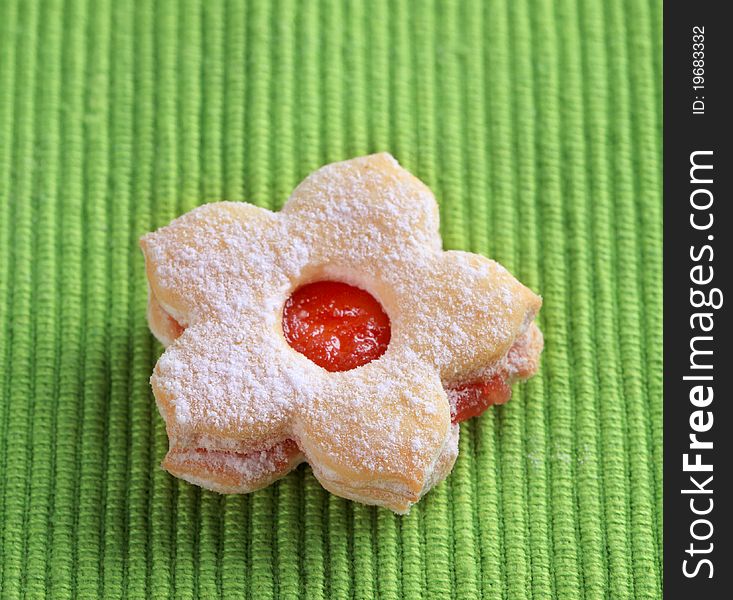 Jam biscuit on a green napkin - closeup