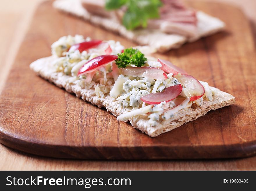 Crispbread with blue cheese and pate - closeup