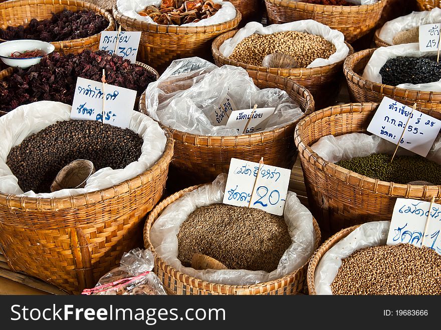 Spices and herbs in bamboo basket at market