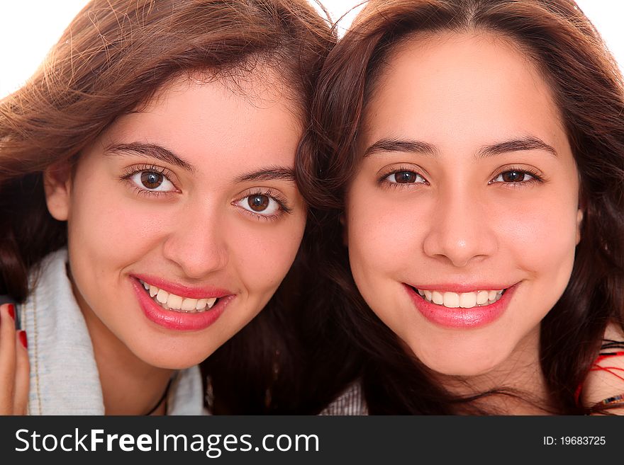 Young women looking at camera over white background