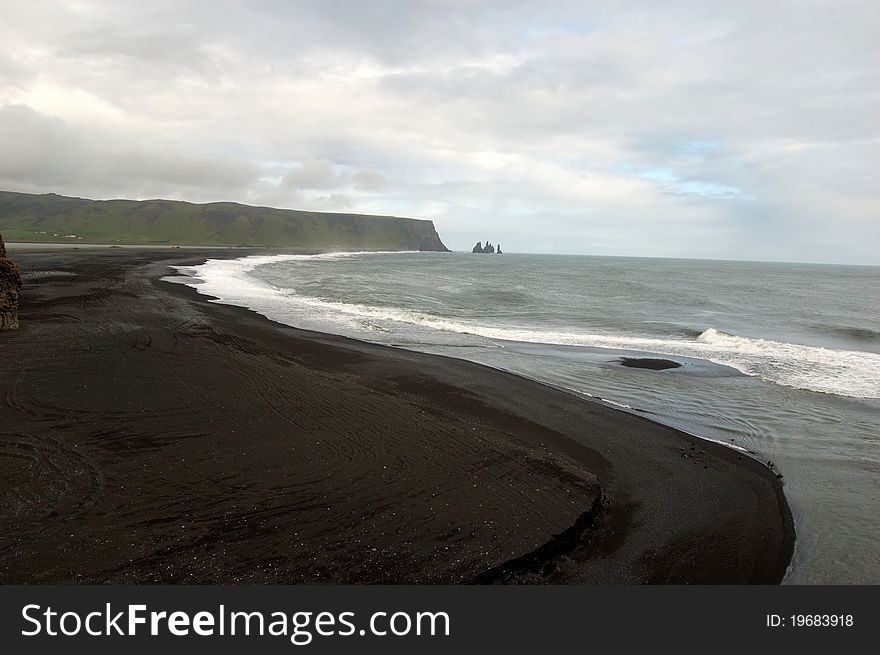 Black, volcanic beach at Dyrholaey, southern Iceland. Black, volcanic beach at Dyrholaey, southern Iceland