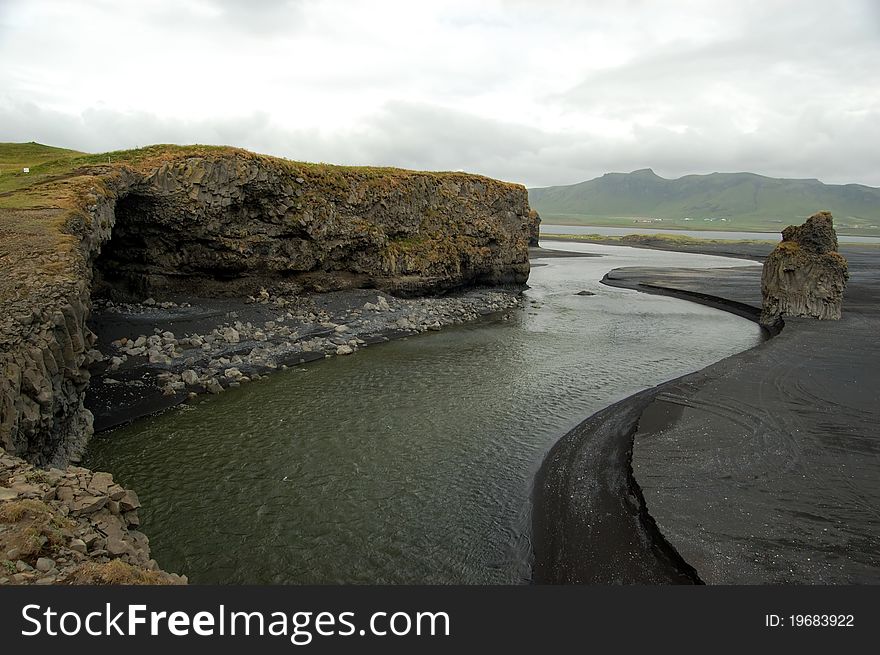 Black, volcanic beach at Dyrholaey, southern Iceland. Black, volcanic beach at Dyrholaey, southern Iceland