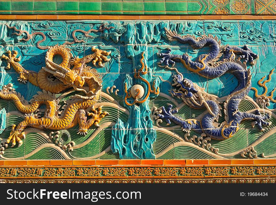 Built in 1756, the Nine-Dragon Screen is about 27 meters (about 88.6 feet) long, 6.65 meters (about 21.8 feet) high and 1.42 meters (4.66 feet) thick. It is composed of 424 seven-color glazed tiles that embossing the screen. Built in 1756, the Nine-Dragon Screen is about 27 meters (about 88.6 feet) long, 6.65 meters (about 21.8 feet) high and 1.42 meters (4.66 feet) thick. It is composed of 424 seven-color glazed tiles that embossing the screen.