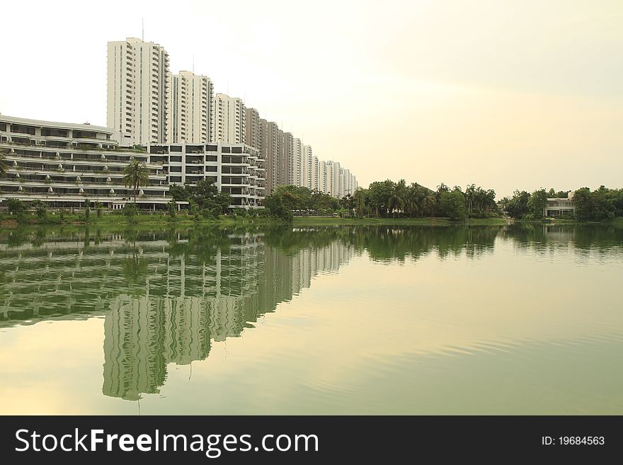 Reflection of row of buildings on the water in arrow-shaped