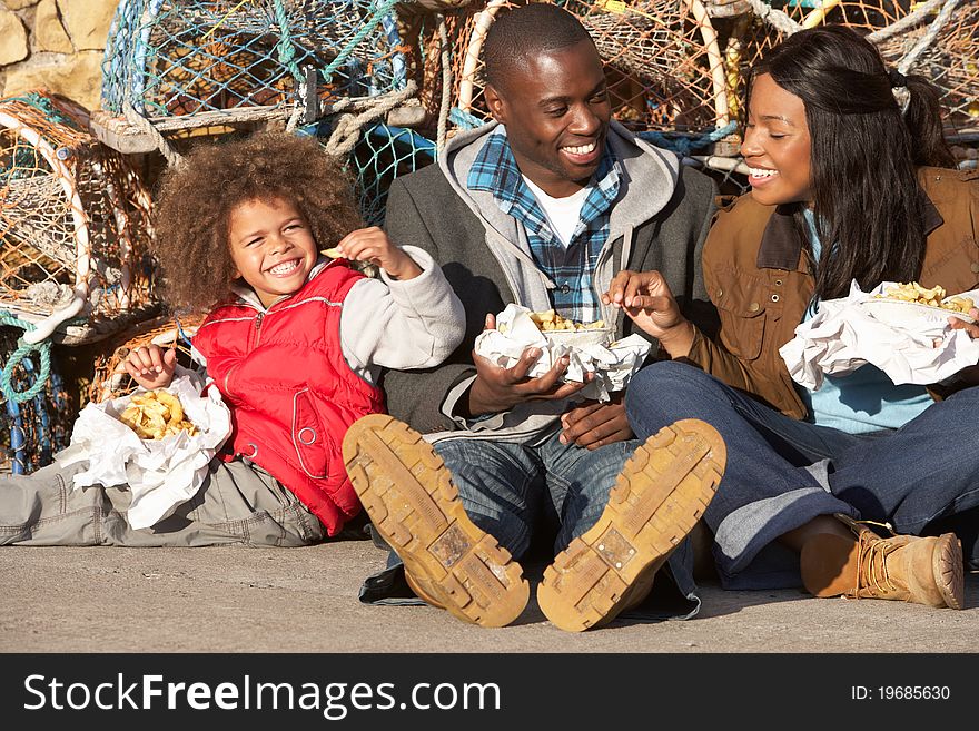 Happy family having picnic smiling