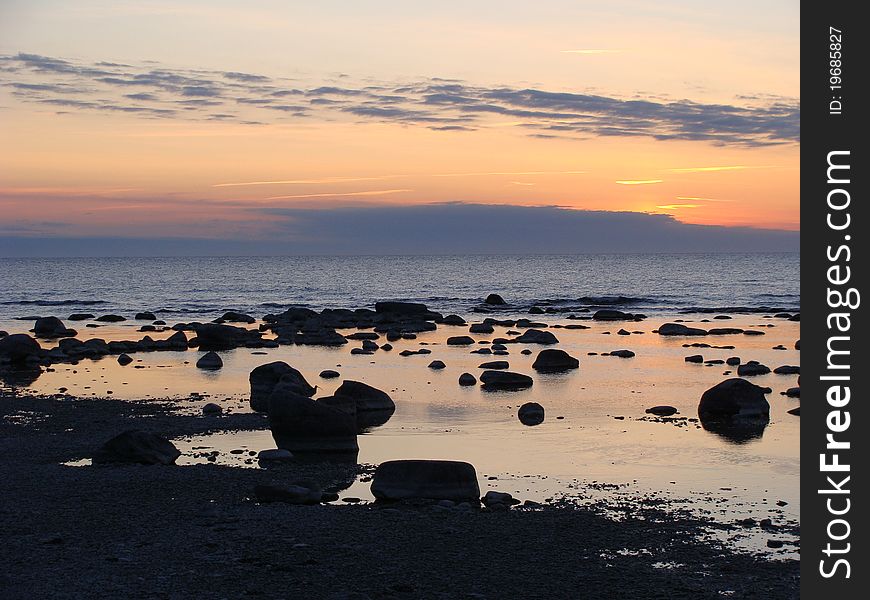 The sea coast in the setting sun; Gotland, Sweden. The sea coast in the setting sun; Gotland, Sweden