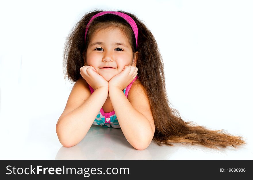 Beautiful little girl isolated on a white background