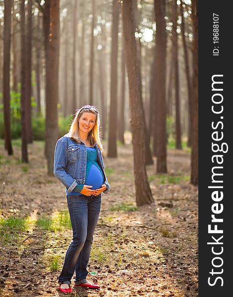 Pregnant woman in the forrest