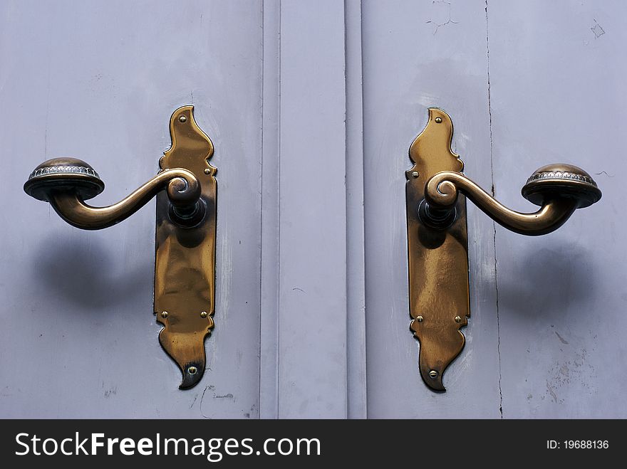 Two door handles on doors in German town Lübeck.