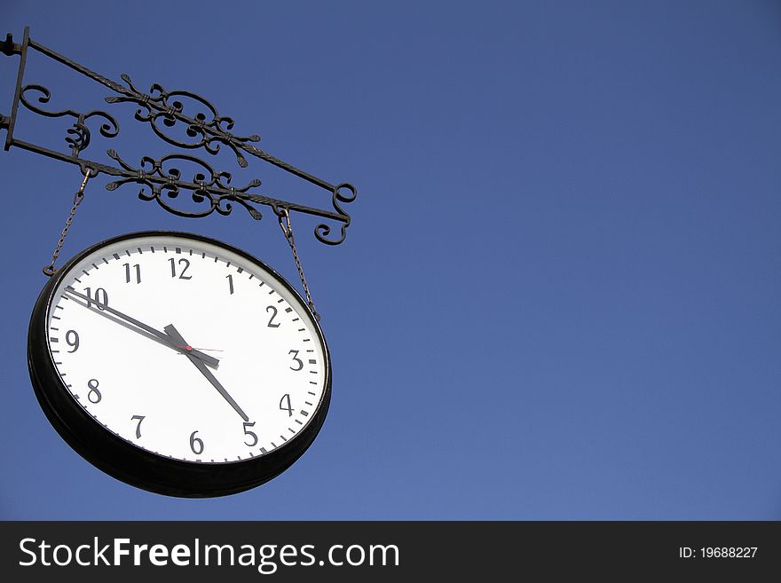 Wall clock and blue sky. Wall clock and blue sky