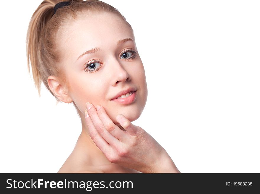 Beautiful blonde girl holding hands near the face, shot on a white background. Beautiful blonde girl holding hands near the face, shot on a white background