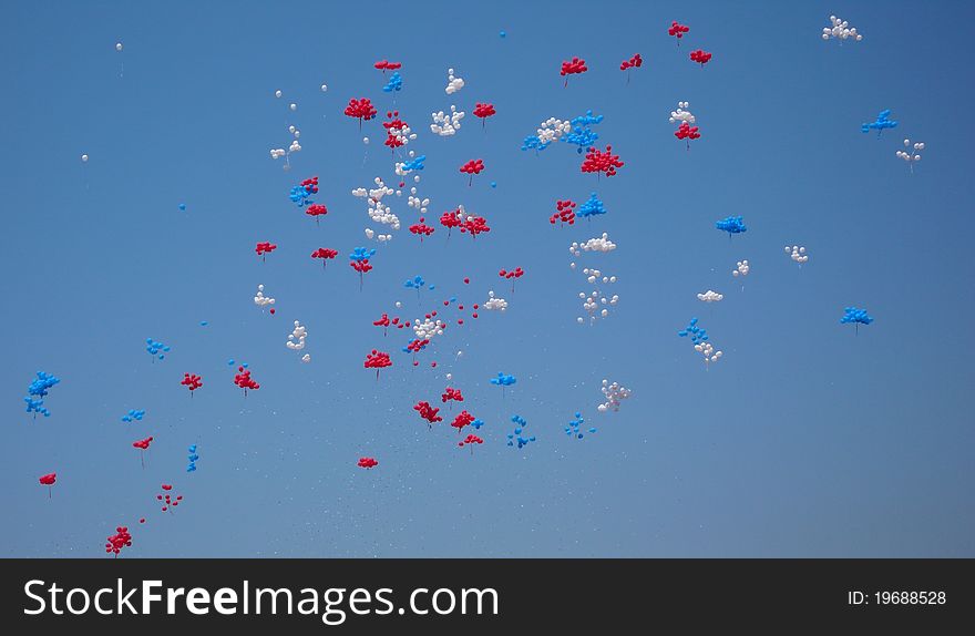 Lots of colorful balloons in the blue sky