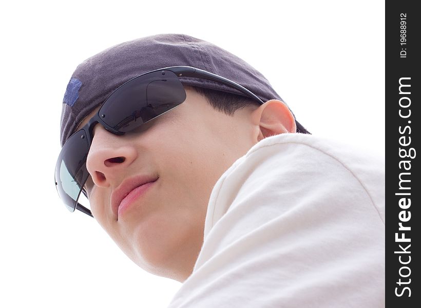 A teenage boy, with sunglasses and cap. A teenage boy, with sunglasses and cap
