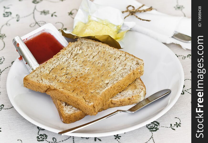 Breads with jam on table