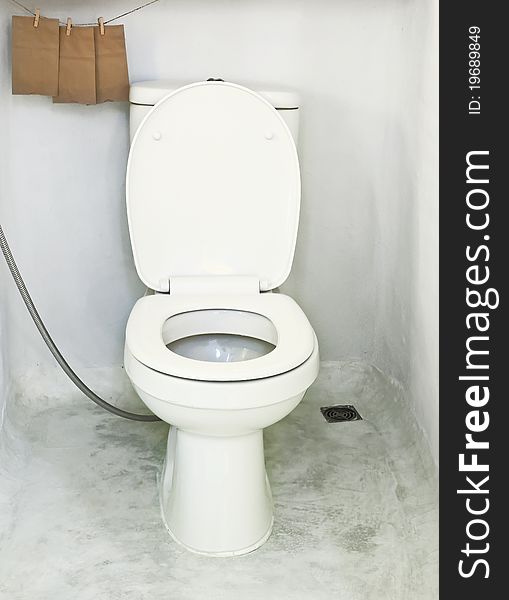 White toilet bowl in bathroom