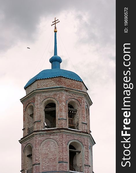 Orthodox chapel on a background of the cloudy sky