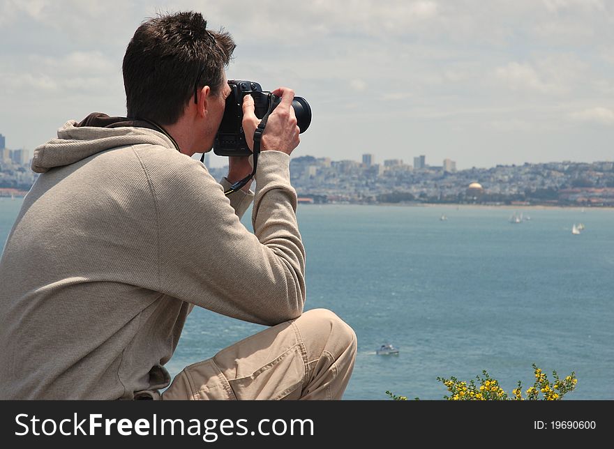 A photographer focuses in on the San Francisco cityscape to capture the perfect image. A photographer focuses in on the San Francisco cityscape to capture the perfect image.