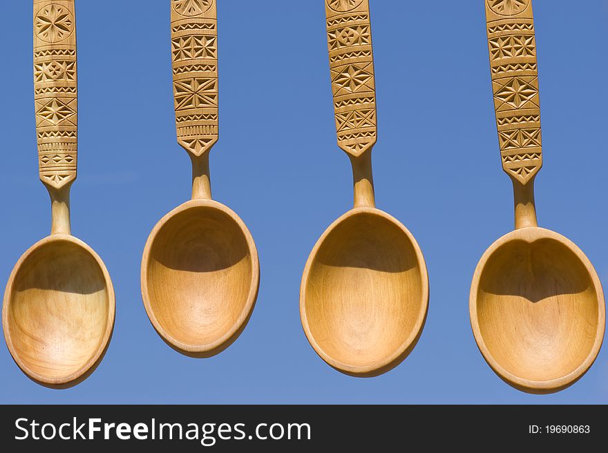 Traditional ukrainian handmade wooden spoons with ornamentation on the handle
