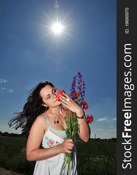 Young pregnant woman dreaming under bright clear blue sky. Young pregnant woman dreaming under bright clear blue sky