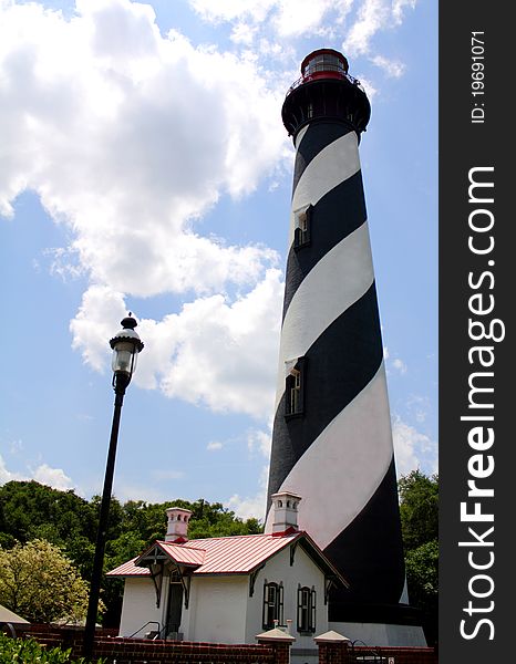 A historic lighthouse by modern street light in St Augustine Florida. A historic lighthouse by modern street light in St Augustine Florida.